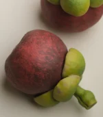 ceramic fruit decor-side view of a ceramic mangosteen