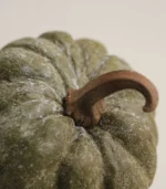 Close-up view of the texture and glaze details on the top of the ceramic pumpkin