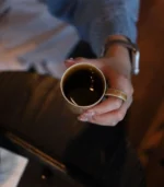 Handmade Ceramic Mugs Top-down view of a hand holding a coffee mug