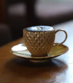 Teacup and Saucer with coffee front view