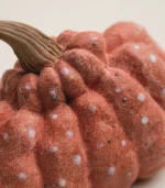 Close-up views of the ceramic pumpkin's texture and glaze details