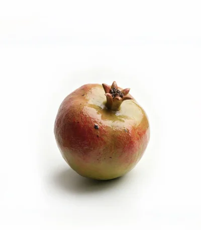 Hand-sculpted ceramic pomegranate dining table centerpiece by Jingee