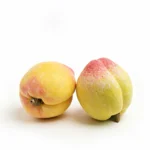 coffee table decor ideas-lifelike porcelain peach with a red blush and velvety finish