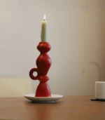 taper candle holders side view of a burning candle