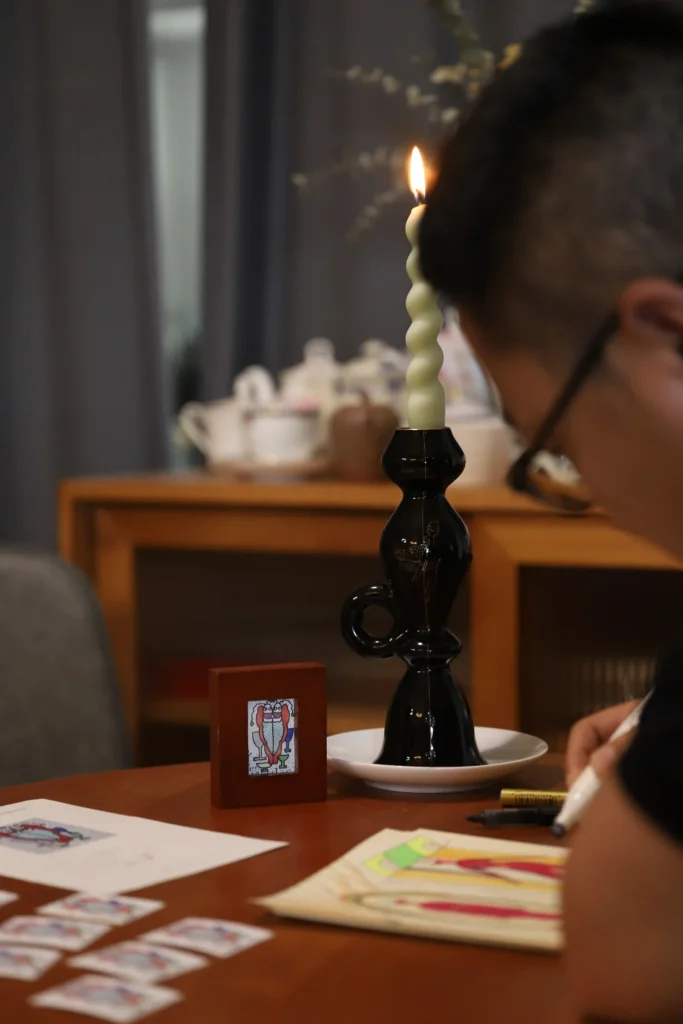 Black Candle Holders Artist Shao Changzong hand-draws sketches for "Dreamer."