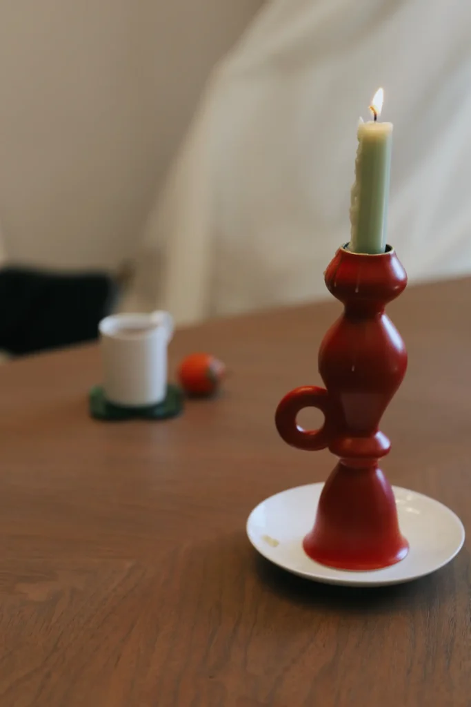 taper candle holders side view of a burning candle 02
